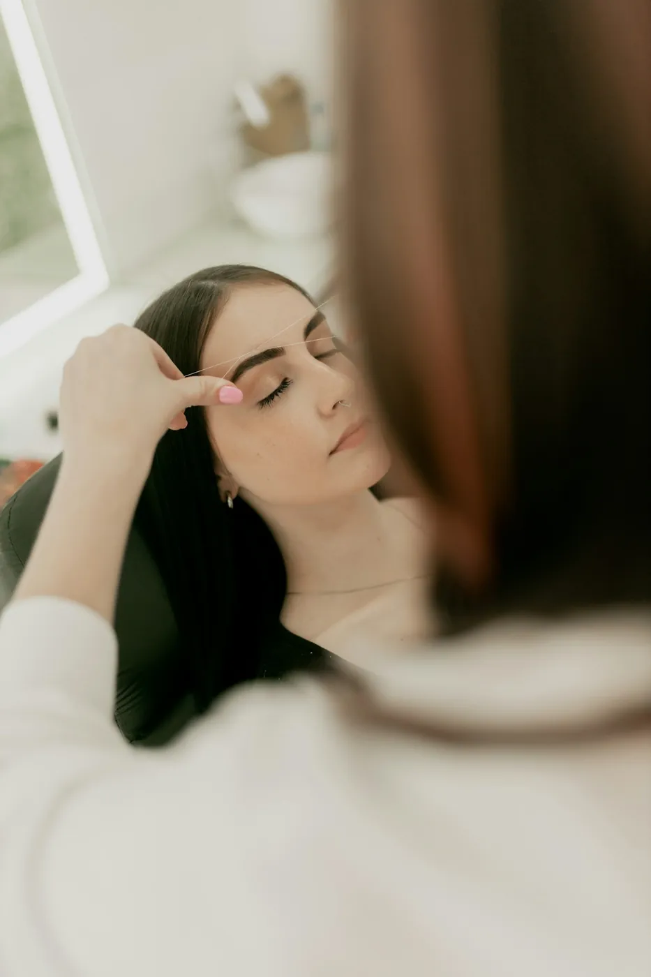 Brow shaping in progress in the studio